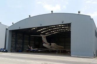 Prestressed steel arch structure of hangar of Macao International Airport